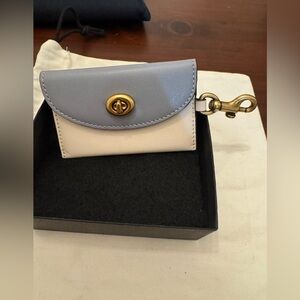 Coach blue and white color-block leather ‘n brass turn lock envelope card case.